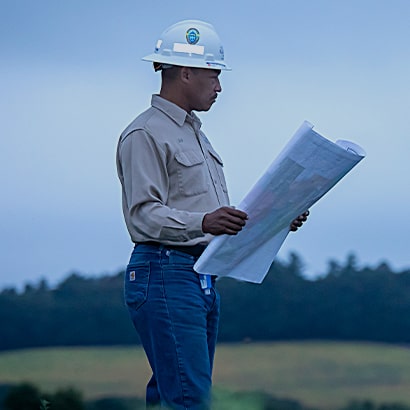 worker looking at map