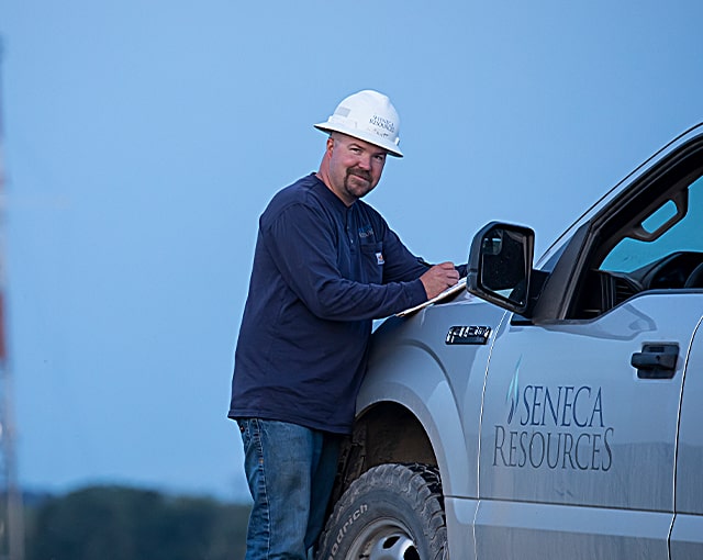 worker in hard hat smiling