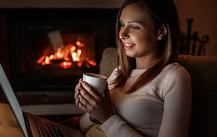 woman by gas fireplace